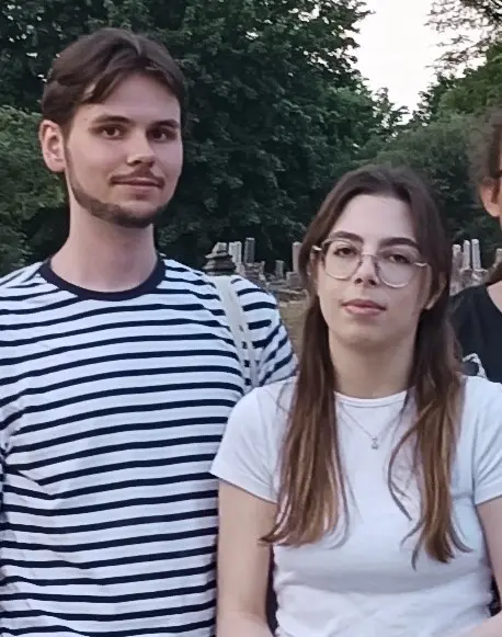 A man and woman standing next to each other.
